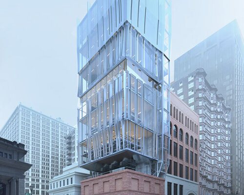 perforated metal panels clad office floating above st. louis's century-old columbia building